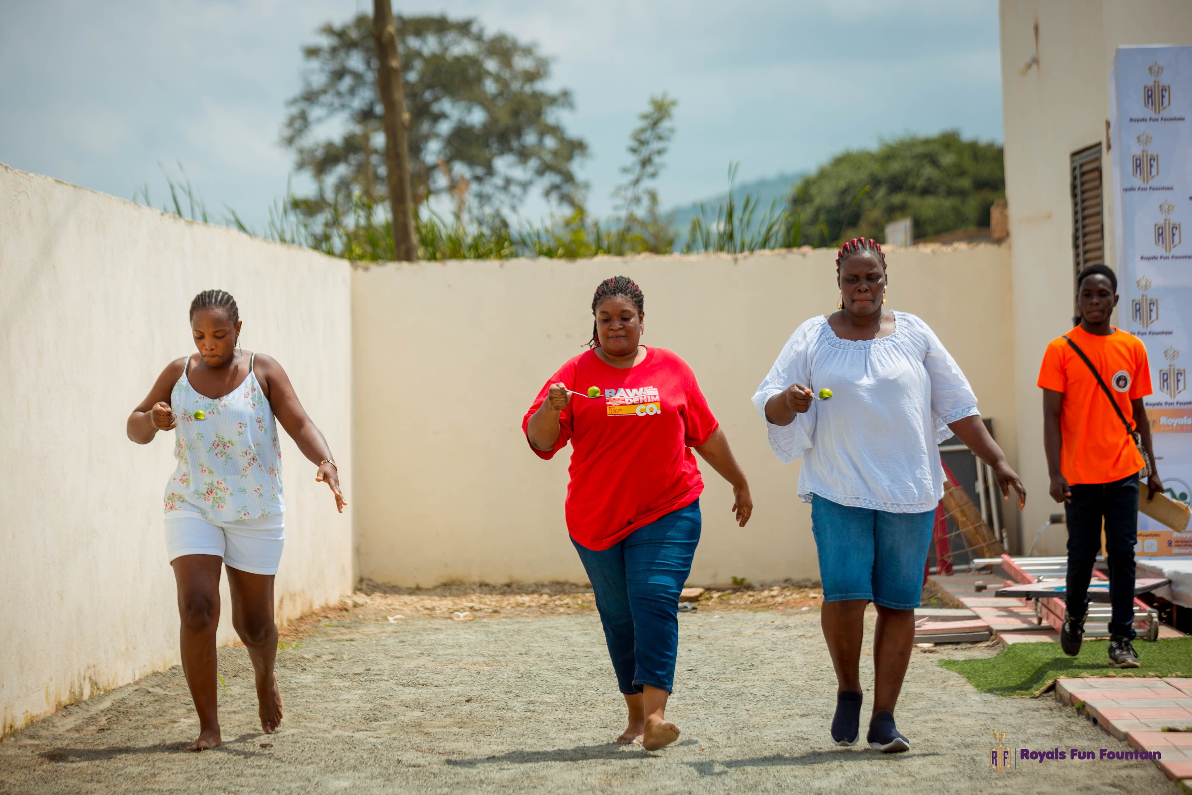 Mums taking part in an egg-and-spoon race