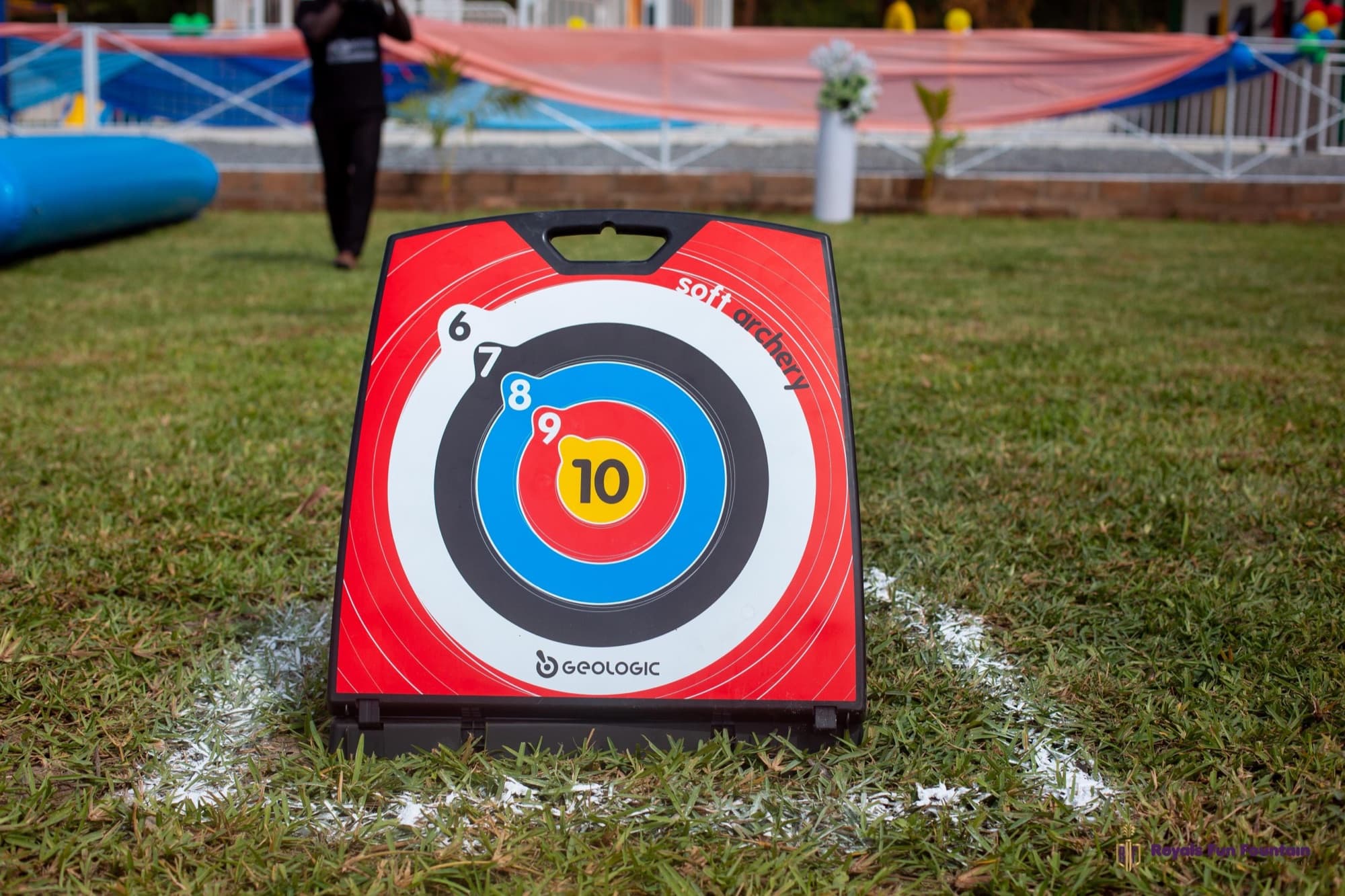 A soft archery target standing on the lawn