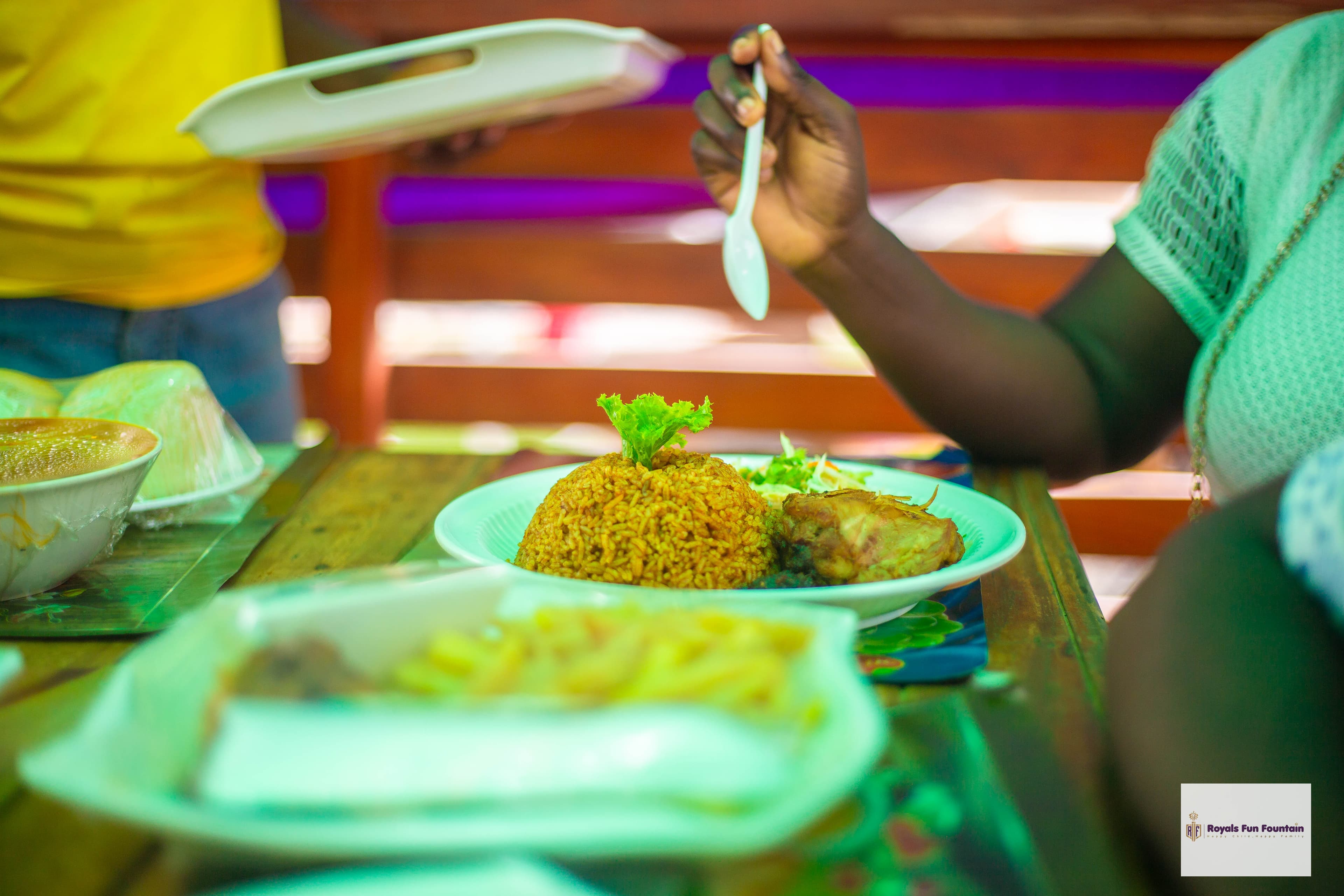 A plate of jollof rice and chicken at the restaurant
